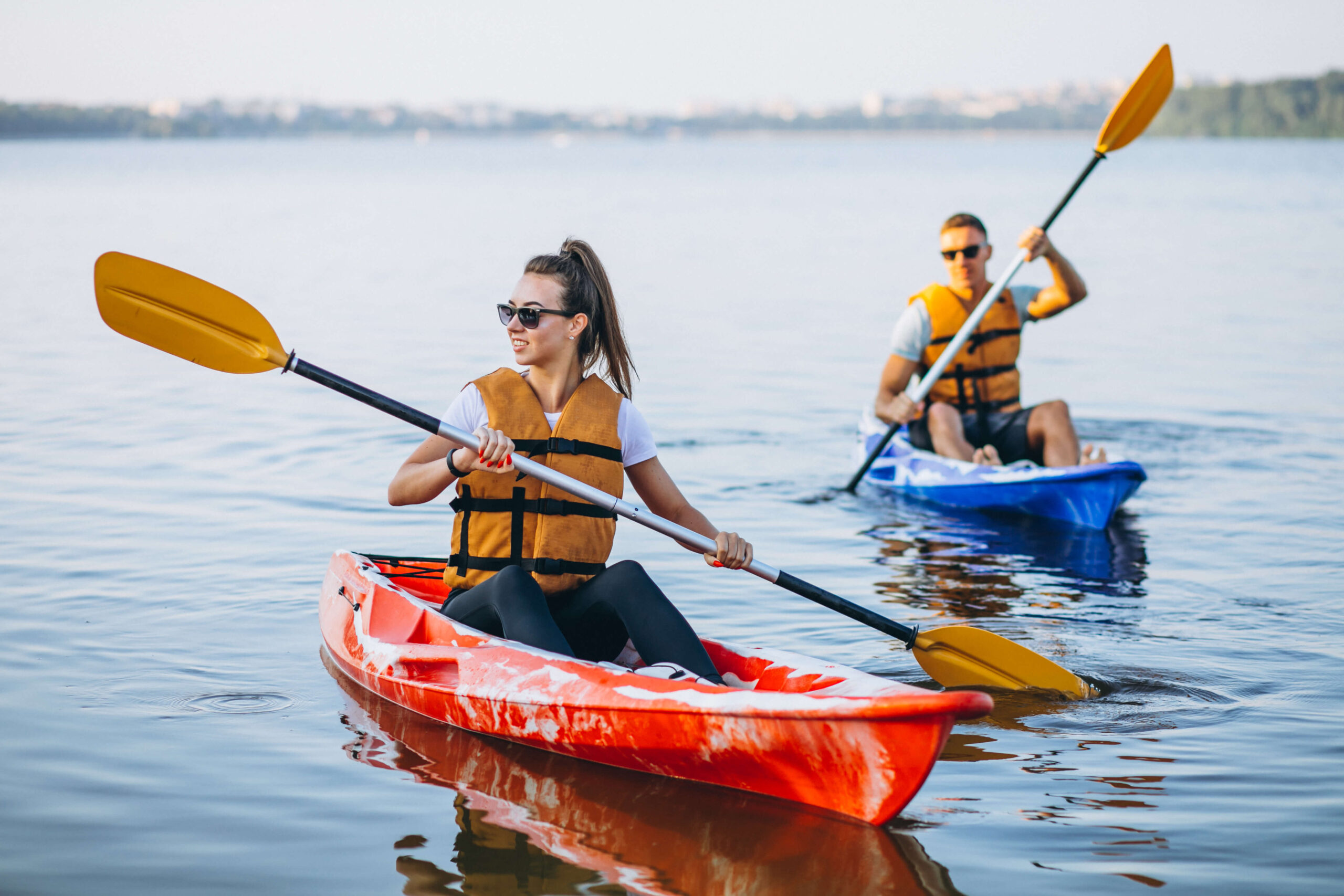 couple-together-kayaking-river