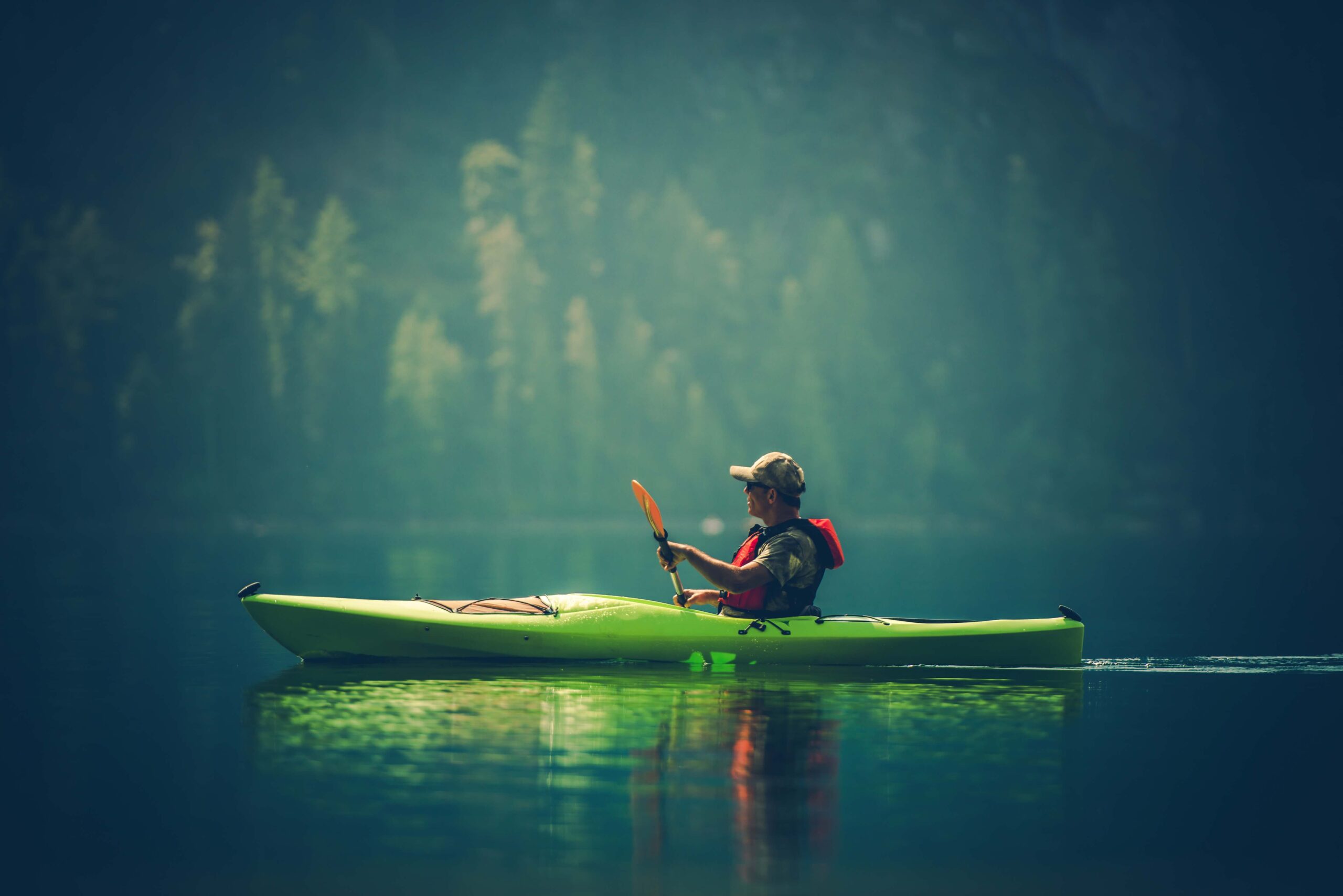 side-view-man-kayaking-lake